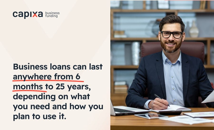A smiling businessman at his desk